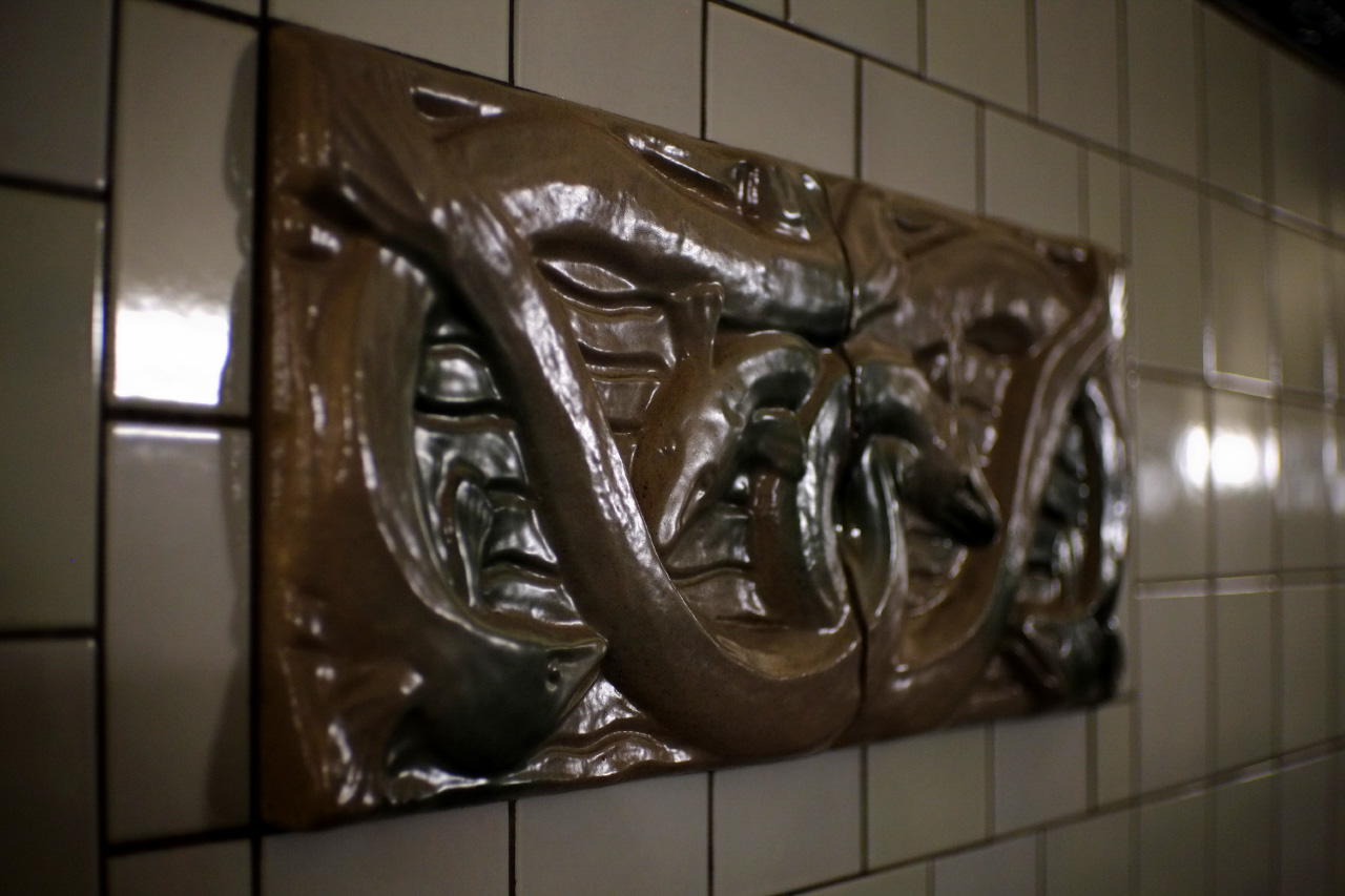 A photo of one of the several glazed terracotta ornaments. This one shows fishes and eels.